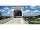 View of the Legacy Trail bridge with blue sky and clouds at 328 Channel Ln, Nokomis, FL 34275
