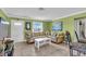 Inviting living room featuring neutral tones, tile flooring, and ample natural light at 328 Channel Ln, Nokomis, FL 34275
