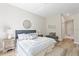 Bedroom with large bed, accent wall, and natural light at 3470 Elias Cir, North Port, FL 34288