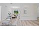 Bright living room seamlessly connected to the dining area with stylish decor at 3470 Elias Cir, North Port, FL 34288