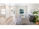 Inviting living room with a comfortable sofa, large windows, and stylish decor at 3470 Elias Cir, North Port, FL 34288