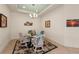 Inviting dining room with a glass-top table and wicker chairs at 371 Capulet Dr, Venice, FL 34292