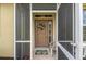 Inviting front entrance featuring a secure screen door and decorative welcome mat at 371 Capulet Dr, Venice, FL 34292
