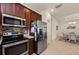Open concept kitchen with stainless steel appliances and breakfast nook access at 371 Capulet Dr, Venice, FL 34292