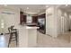 Modern kitchen with stainless steel appliances, breakfast bar, and ample cabinet space at 371 Capulet Dr, Venice, FL 34292