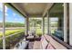 Inviting screened lanai with comfortable seating and a view of lush green landscape at 371 Capulet Dr, Venice, FL 34292
