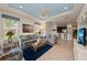 Open floor plan living room with kitchen bar and comfortable seating area at 371 Capulet Dr, Venice, FL 34292