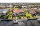 Stunning aerial view of a home with a pool, dock, and expansive waterfront property at 3819 Aves Island Ct, Punta Gorda, FL 33950