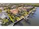 Gorgeous aerial view of a pool home with a private boat dock and lush landscaping at 3819 Aves Island Ct, Punta Gorda, FL 33950