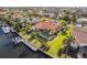 Beautiful aerial view showcasing a home with a pool, dock, and lush landscaping at 3819 Aves Island Ct, Punta Gorda, FL 33950