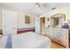 Bedroom features hardwood floors, a ceiling fan, and a large dresser at 3819 Aves Island Ct, Punta Gorda, FL 33950