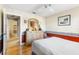 This bedroom features hardwood floors, a ceiling fan, and a large dresser at 3819 Aves Island Ct, Punta Gorda, FL 33950