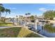 Private boat dock with a boat lift, offering convenient access to the canal and waterfront activities at 3819 Aves Island Ct, Punta Gorda, FL 33950