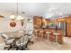 Cozy kitchen with natural wood cabinets, stainless steel appliances, and a breakfast bar with seating at 3819 Aves Island Ct, Punta Gorda, FL 33950