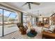 Spacious screened lanai with comfortable seating, a ceiling fan, and views of the pool and waterfront at 3819 Aves Island Ct, Punta Gorda, FL 33950