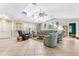 Bright, open living room with skylights, ceiling fans, and neutral tones showcases comfortable seating at 3819 Aves Island Ct, Punta Gorda, FL 33950