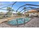 Screened-in pool area with a brick-paved deck, providing a relaxing outdoor space with waterfront views at 3819 Aves Island Ct, Punta Gorda, FL 33950