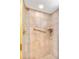 The tiled shower features gold fixtures, a handheld shower head, and a grab bar at 3819 Aves Island Ct, Punta Gorda, FL 33950