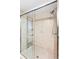 Glass shower featuring tile walls, a shower head, and glass sliding doors at 3819 Aves Island Ct, Punta Gorda, FL 33950