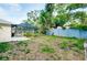 Spacious backyard featuring a screened-in pool area and mature landscaping at 420 Zephyr Rd, Venice, FL 34293