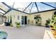 Enjoy the sun on this outdoor patio next to pool and mature landscaping, perfect for entertaining at 420 Zephyr Rd, Venice, FL 34293