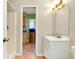Bathroom featuring a vanity with storage and a decorative mirror, offering practical style at 420 Zephyr Rd, Venice, FL 34293