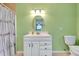 Bathroom featuring a vanity with storage and a shower-tub combo, offering practicality at 420 Zephyr Rd, Venice, FL 34293