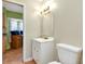 Bathroom featuring a vanity with storage and a decorative mirror, offering practical style at 420 Zephyr Rd, Venice, FL 34293