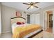 Cozy bedroom featuring ceiling fan and closet, providing ample storage space at 420 Zephyr Rd, Venice, FL 34293