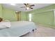Spacious bedroom with tile floors, fan, and a large window allowing ample natural light at 420 Zephyr Rd, Venice, FL 34293