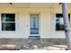 Inviting front entrance with decorative tile flooring and a secure screen door for added ventilation at 420 Zephyr Rd, Venice, FL 34293