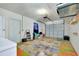 Spacious garage with ample storage, colorful flooring, and a functional layout, ready for your projects at 420 Zephyr Rd, Venice, FL 34293