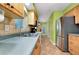 Bright kitchen featuring wood cabinets, stainless steel appliances and neutral countertops at 420 Zephyr Rd, Venice, FL 34293