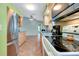 Bright kitchen featuring wood cabinets, stainless steel appliances, tile flooring, and neutral countertops at 420 Zephyr Rd, Venice, FL 34293
