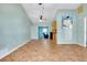 Spacious living room with tile floors and refreshing paint color, open layout and ceiling fans at 420 Zephyr Rd, Venice, FL 34293