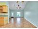 Light-filled living space with tile floors, providing an open flow to the kitchen, and neutral wall color at 420 Zephyr Rd, Venice, FL 34293