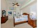 Coastal bedroom featuring high ceilings, a ceiling fan, and a light and airy ambiance at 4358 Via Del Villetti Dr, Venice, FL 34293