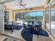 Relaxing lanai area with outdoor seating, a ceiling fan, and a view of the pool at 4358 Via Del Villetti Dr, Venice, FL 34293