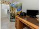 Office nook featuring a desk, printer, and laundry room access at 4358 Via Del Villetti Dr, Venice, FL 34293