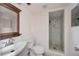 Modern bathroom with marble tiled shower and updated vanity at 440 Monza Ave, North Port, FL 34287