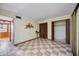 Bedroom featuring checkered tile floors, neutral walls, and closet at 440 Monza Ave, North Port, FL 34287