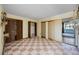 Bedroom showcasing checkered tile floors, neutral walls, and closets at 440 Monza Ave, North Port, FL 34287