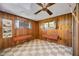 Wood-paneled bedroom with checkered floors and built-in benches at 440 Monza Ave, North Port, FL 34287