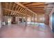 Expansive great room featuring exposed wooden beams, high ceilings, and ample natural light at 440 Monza Ave, North Port, FL 34287