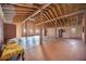 Spacious great room featuring high ceilings, wooden beams, and a rustic chandelier at 440 Monza Ave, North Port, FL 34287