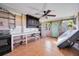 Retro kitchen featuring vintage cabinets, concrete countertops, and a ceiling fan at 440 Monza Ave, North Port, FL 34287