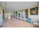 Spacious lanai with tile flooring and screen windows at 440 Monza Ave, North Port, FL 34287