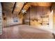 Empty living room featuring wooden paneling, high ceilings, and tile flooring at 440 Monza Ave, North Port, FL 34287
