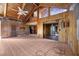 Living room featuring wooden paneling, high ceilings, and sliding doors at 440 Monza Ave, North Port, FL 34287