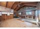 Large room featuring vaulted wood ceilings, a second-story balcony, and built-in shelves at 440 Monza Ave, North Port, FL 34287
